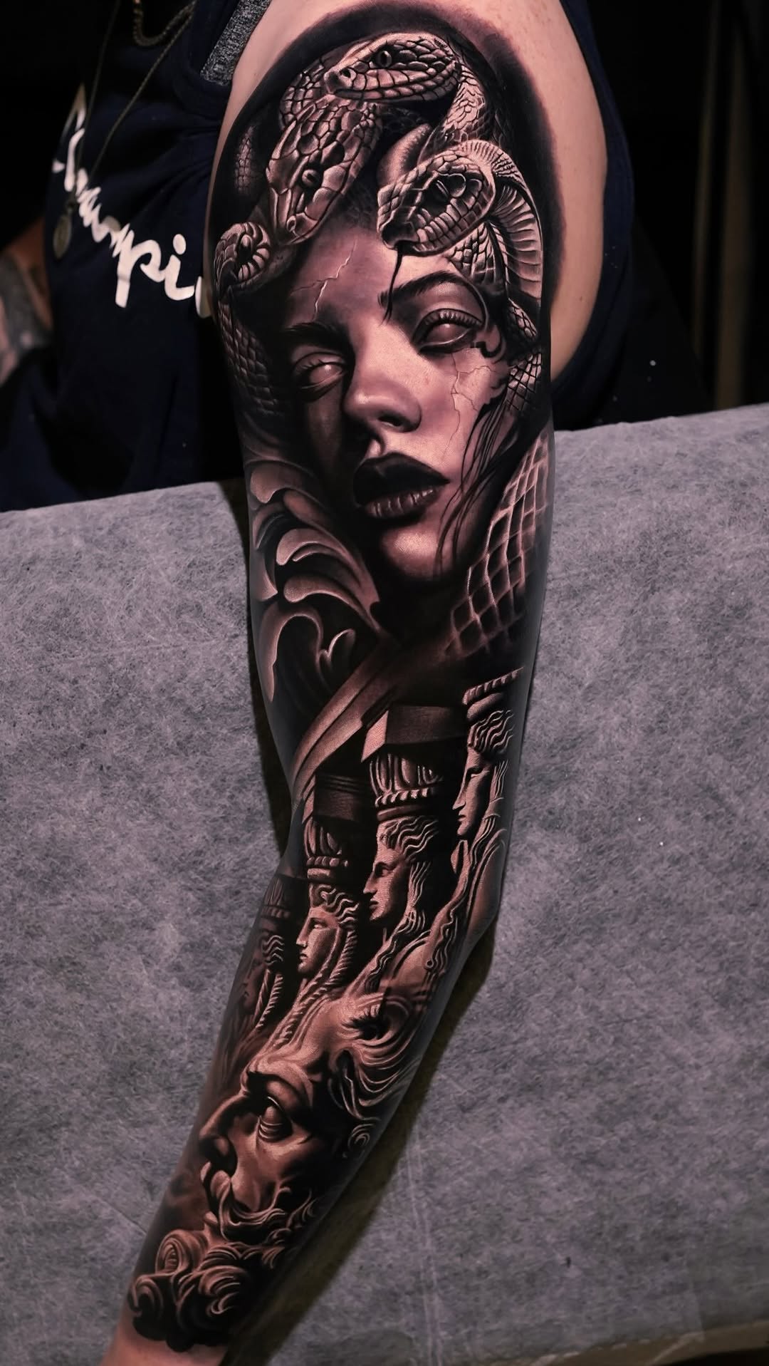 Black and grey sleeve featuring a sculptural female portrait by George Lange